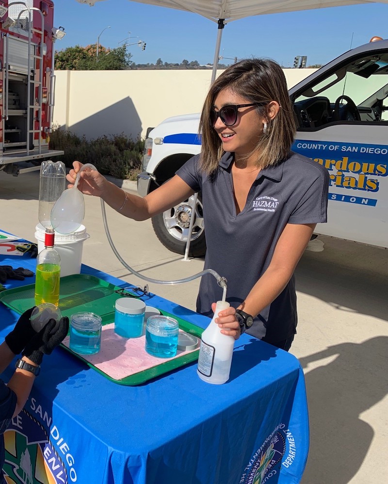 An Environmental Health Specialist from the County of San Diego Hazardous Materials Division demonstrates a science experiment using soap, water and dry ice.